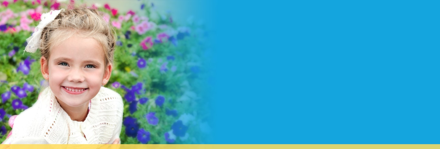 Young girl smiling in garden